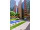 Serene courtyard featuring a fountain, green spaces, and pathways between buildings at 4808 N 24Th St # 1402, Phoenix, AZ 85016