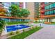 Inviting courtyard space with a central fountain, seating, and lush landscaping at 4808 N 24Th St # 1402, Phoenix, AZ 85016