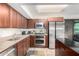 Modern kitchen features stainless steel appliances, granite countertops, and ample storage at 4808 N 24Th St # 1402, Phoenix, AZ 85016