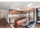 Modern kitchen features sleek stainless steel appliances and a breakfast bar at 4808 N 24Th St # 1402, Phoenix, AZ 85016