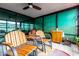 Cozy enclosed patio area with comfortable seating and lots of natural light at 4808 N 24Th St # 1402, Phoenix, AZ 85016