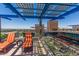 Rooftop patio with lounge chairs and city views, complete with shaded pergola at 4808 N 24Th St # 1402, Phoenix, AZ 85016