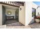 Elegant balcony with herringbone brick and an open doorway to the home's interior and backyard at 5101 N Casa Blanca Dr # 25, Paradise Valley, AZ 85253