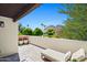 Sunny balcony with lounge chairs and panoramic views of the surrounding desert landscape and mountains at 5101 N Casa Blanca Dr # 25, Paradise Valley, AZ 85253