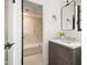 Modern bathroom with a wood vanity, a large mirror, and a shower-tub combination at 5101 N Casa Blanca Dr # 25, Paradise Valley, AZ 85253