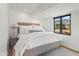 Comfortable bedroom with a large window, a queen bed and neutral decor and mountain views at 5101 N Casa Blanca Dr # 25, Paradise Valley, AZ 85253