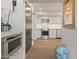 Modern kitchen featuring stainless steel appliances, light gray cabinetry, and hardwood flooring at 5101 N Casa Blanca Dr # 25, Paradise Valley, AZ 85253