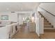 Bright living room with hardwood floors, white walls, and a staircase visible at 5101 N Casa Blanca Dr # 25, Paradise Valley, AZ 85253