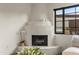 Living room with a corner fireplace and a window view to the exterior at 5101 N Casa Blanca Dr # 25, Paradise Valley, AZ 85253