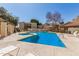 Community pool featuring a jacuzzi, lounge chairs and nearby complex buildings at 520 N Stapley Dr # 257, Mesa, AZ 85203