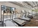 Well-equipped fitness center with treadmills and large windows overlooking the outdoors at 535 W Thomas Rd # 207, Phoenix, AZ 85013