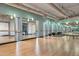 Bright yoga studio with wood floors, mirrored walls, and fitness equipment at 535 W Thomas Rd # 207, Phoenix, AZ 85013