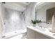 Modern bathroom boasts marble shower, contemporary vanity, and elegant finishes at 6587 N Palmeraie Blvd # 2041, Paradise Valley, AZ 85253