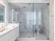 Modern bathroom with glass-enclosed shower, sleek vanity, and floor-to-ceiling marble walls at 6587 N Palmeraie Blvd # 2041, Paradise Valley, AZ 85253