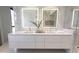 Elegant bathroom featuring a double vanity, modern fixtures, and pristine white countertops at 6587 N Palmeraie Blvd # 2041, Paradise Valley, AZ 85253
