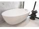 Stylish freestanding bathtub with modern fixtures and marble accents, perfect for relaxation at 6587 N Palmeraie Blvd # 2041, Paradise Valley, AZ 85253