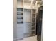 Well-organized walk-in closet with shelves, drawers, and hanging rods for ample storage at 6587 N Palmeraie Blvd # 2041, Paradise Valley, AZ 85253