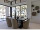 Dining area with a dark wooden table and views of the palm trees at 6587 N Palmeraie Blvd # 2041, Paradise Valley, AZ 85253