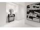 Elegant foyer with a console table, lamps, mirror, and modern art at 6587 N Palmeraie Blvd # 2041, Paradise Valley, AZ 85253