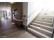 Hallway with a staircase and wall art next to a wood table and decorative accents at 6587 N Palmeraie Blvd # 2041, Paradise Valley, AZ 85253