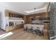 Well-equipped kitchen features wood cabinetry, an island with seating, and modern appliances at 6587 N Palmeraie Blvd # 2041, Paradise Valley, AZ 85253