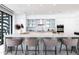Modern kitchen with a marble island, white cabinetry, pendant lighting, and stainless steel appliances at 6587 N Palmeraie Blvd # 2041, Paradise Valley, AZ 85253
