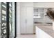 Bright, modern kitchen featuring floor-to-ceiling cabinets, and marble countertops at 6587 N Palmeraie Blvd # 2041, Paradise Valley, AZ 85253