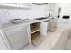 Kitchen features custom cabinetry with pull-out shelves, modern appliances, and marble countertops at 6587 N Palmeraie Blvd # 2041, Paradise Valley, AZ 85253