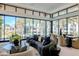 Stylish living room with ample seating and expansive views through large windows at 6587 N Palmeraie Blvd # 2041, Paradise Valley, AZ 85253