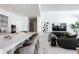 Open-concept living space with barstool seating at counter and comfortable living room set at 6587 N Palmeraie Blvd # 2041, Paradise Valley, AZ 85253