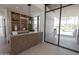 The bright lobby has wood accents, contemporary furniture, and glass doors to the exterior at 6587 N Palmeraie Blvd # 2041, Paradise Valley, AZ 85253
