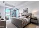 Sun-filled main bedroom with plush seating, king bed, and balcony access at 6587 N Palmeraie Blvd # 2041, Paradise Valley, AZ 85253