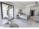 Bright and airy main bedroom featuring seating area, and sliding glass doors at 6587 N Palmeraie Blvd # 2041, Paradise Valley, AZ 85253