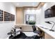 Contemporary office space with custom cabinets, stylish decor, a sleek desk, and ample natural light at 6587 N Palmeraie Blvd # 2041, Paradise Valley, AZ 85253