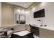 Elegant home office featuring built-in storage, a modern desk, and sophisticated decor for a productive workspace at 6587 N Palmeraie Blvd # 2041, Paradise Valley, AZ 85253