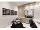 Well-appointed office area showcasing custom cabinetry, modern artwork, and a comfortable workspace at 6587 N Palmeraie Blvd # 2041, Paradise Valley, AZ 85253