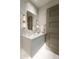 Chic powder room featuring stylish wallpaper, modern lighting, and a floating vanity with decorative accents at 6587 N Palmeraie Blvd # 2041, Paradise Valley, AZ 85253