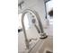 Modern stainless steel kitchen sink with a sleek, high-arc faucet at 6587 N Palmeraie Blvd # 2041, Paradise Valley, AZ 85253