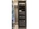 Electronics in the room feature a cabinet with a transparent door and nearby storage at 6587 N Palmeraie Blvd # 2041, Paradise Valley, AZ 85253
