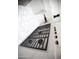 Modern kitchen with a Wolf range and glass range hood at 6587 N Palmeraie Blvd # 2041, Paradise Valley, AZ 85253