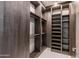Spacious walk-in closet featuring custom shelving, hanging rods, and built-in organization at 6587 N Palmeraie Blvd # 2041, Paradise Valley, AZ 85253