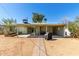 Backyard featuring a covered patio, hardscape walkway, a small tree, and a privacy wall at 7327 N 21St Ave, Phoenix, AZ 85021