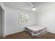 Bedroom with a window and interior door, complemented by neutral carpeting and a mattress at 7327 N 21St Ave, Phoenix, AZ 85021