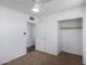 Bedroom with a closet and interior door, complemented by neutral carpeting at 7327 N 21St Ave, Phoenix, AZ 85021