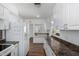 Bright kitchen featuring white cabinetry, stainless steel appliances, and laminate countertops at 7327 N 21St Ave, Phoenix, AZ 85021