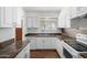 Efficient kitchen featuring white cabinetry, stainless steel appliances, and laminate countertops at 7327 N 21St Ave, Phoenix, AZ 85021