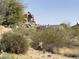 Desert property featuring native landscaping and rock formations with desert architecture at 7435 E Quien Sabe Way, Scottsdale, AZ 85266