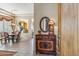 Elegant foyer with a decorative cabinet, mirror, and views into the living spaces at 7435 E Quien Sabe Way, Scottsdale, AZ 85266