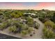 Aerial view showcasing property on a large lot with desert landscaping and mountain views at 7451 E Long Rifle Rd, Carefree, AZ 85377