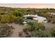 Desert home features a backyard pool and a red tiled roof at 7451 E Long Rifle Rd, Carefree, AZ 85377